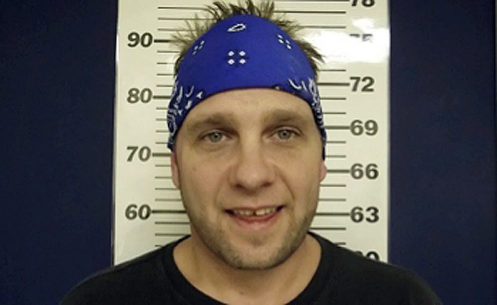 In this D’Iberville Police Department photo released on Wednesday, Feb. 19, 2014, 3 Doors Down bassist Todd Harrell poses for a photograph. 