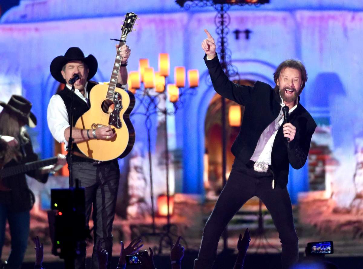 FILE – In this April 19, 2015 file photo, Kix Brooks, left, and Ronnie Dunn, of Brooks & Dunn, perform at the 50th annual Academy of Country Music Awards in Arlington, Texas.