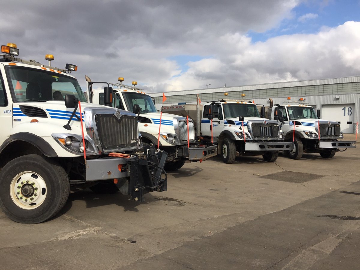 Four Edmonton snow removal vehicles in the city maintenance yard on Oct. 2, 2018.