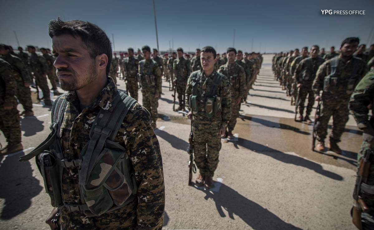 Photo released April 4, 2018 by the Kurdish YPG shows Kurdish fighters in northern Syria.