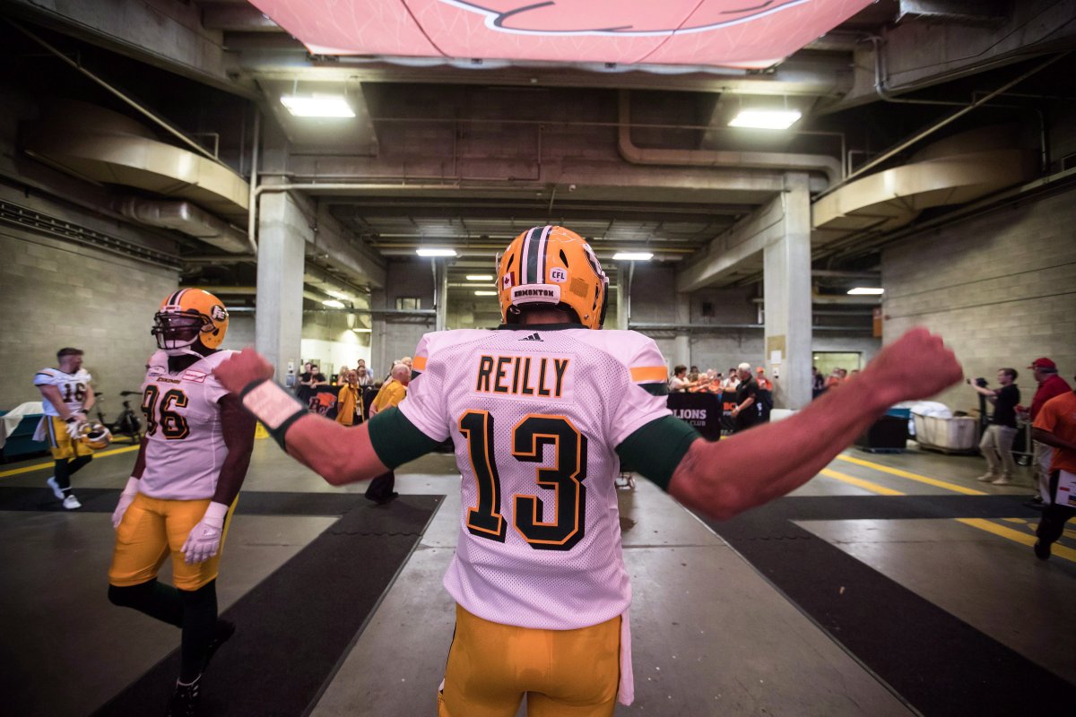 Edmonton Eskimos quarterback Mike Reilly stretches before a CFL football game against the B.C. Lions, in Vancouver on Thursday, August 9, 2018. 