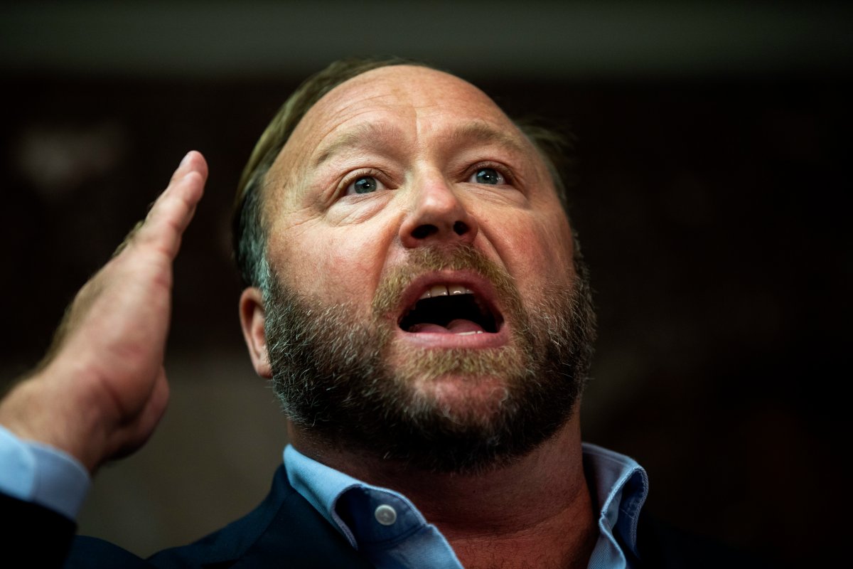 Radio host and conspiracy theorist Alex Jones speaks to the media outside of a Senate Intelligence Committee hearing with CEO of Twitter Jack Dorsey and COO of Facebook Sheryl Sandberg in the Dirksen Senate Office Building in Washington, DC, Sept. 5, 2018 



.