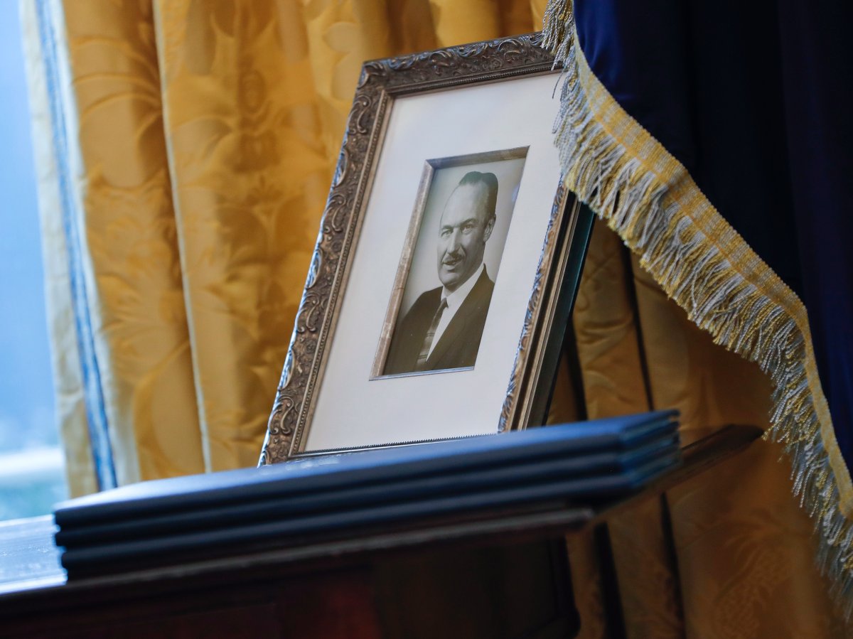 A portrait of President Donald Trump's father Fred Trump, and three un-signed Executive orders are seen in the Oval Office of the White House in Washington. 