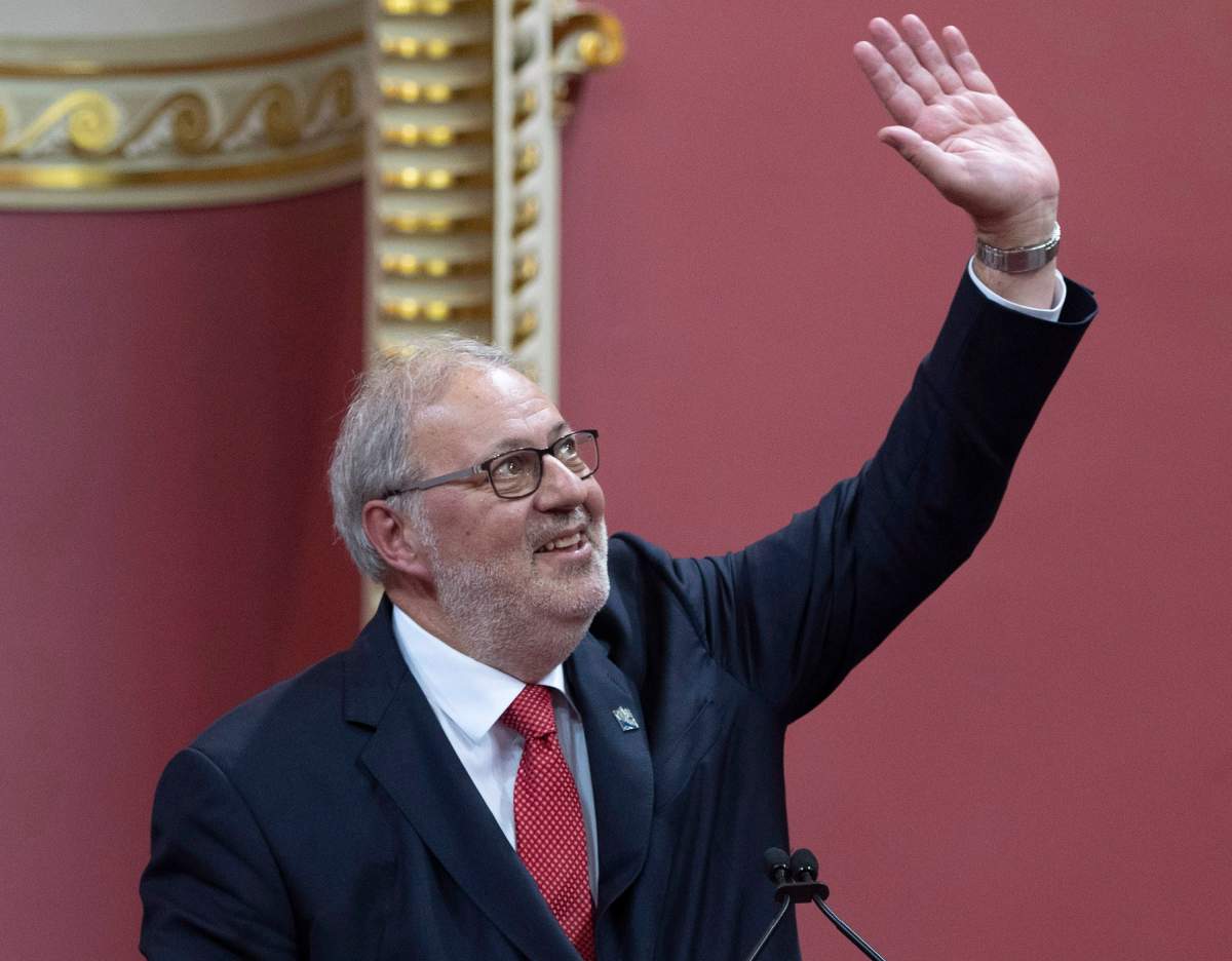 Quebec Liberal Opposition Leader Pierre Arcand waves to the applauding crowd as he is sworn in as member of the National Assembly Monday, Oct. 15, 2018, at the legislature in Quebec City. 