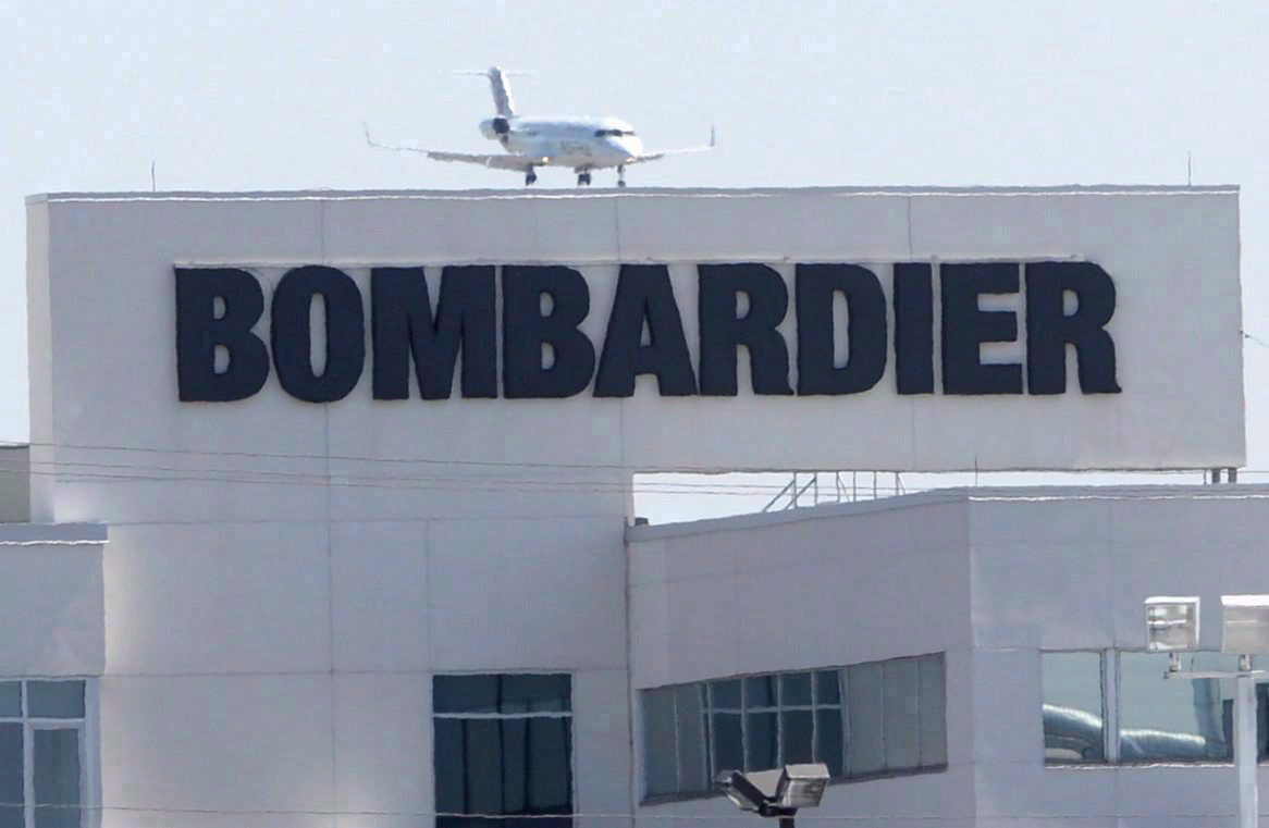 A plane comes in for a landing at a Bombardier plant in Montreal, May 14, 2015. 