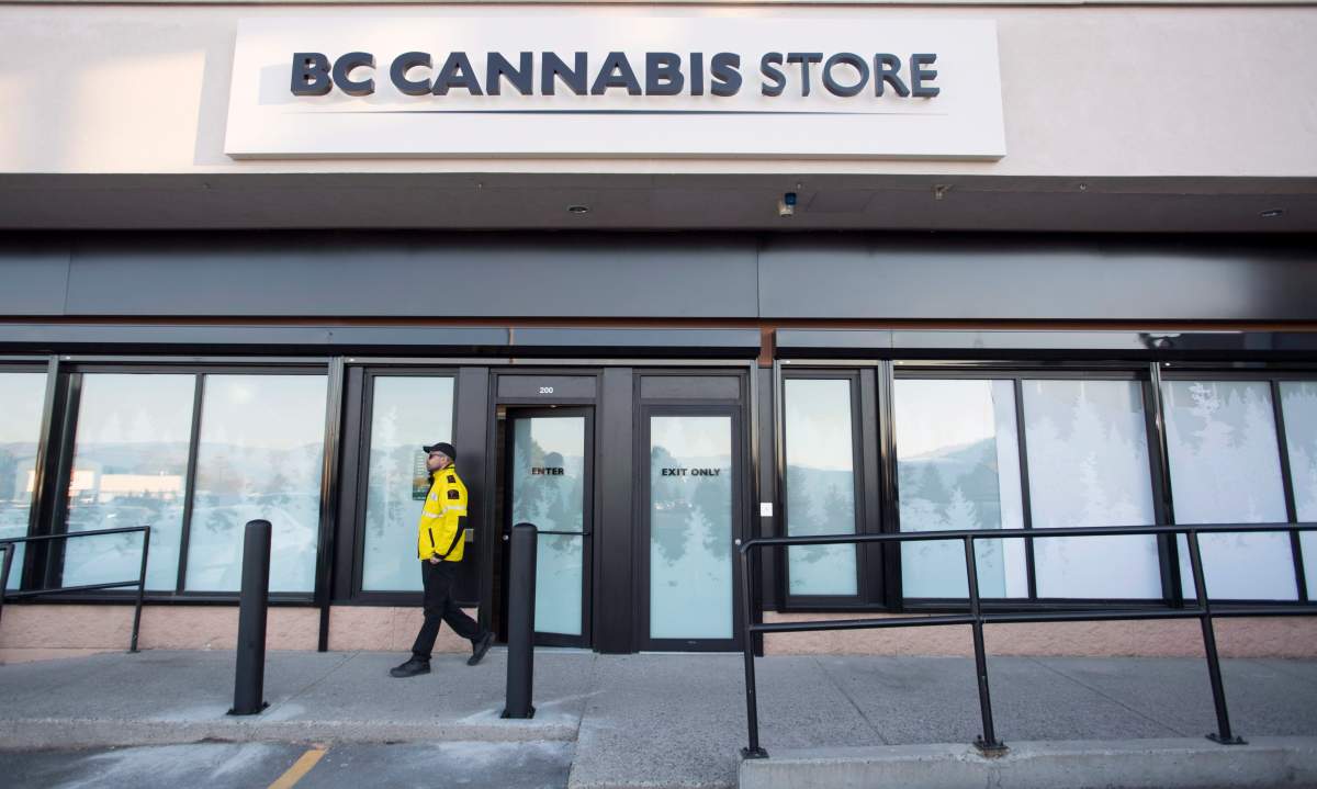 A security guard walks outside British Columbia’s first legal B.C. cannabis store in Kamloops, B.C. Tuesday, Oct. 16, 2018. Canada will legalize cannabis nation wide on Wednesday, Oct. 17 2018 allowing stores across the country to open and legally sell cannabis and cannabis products.
