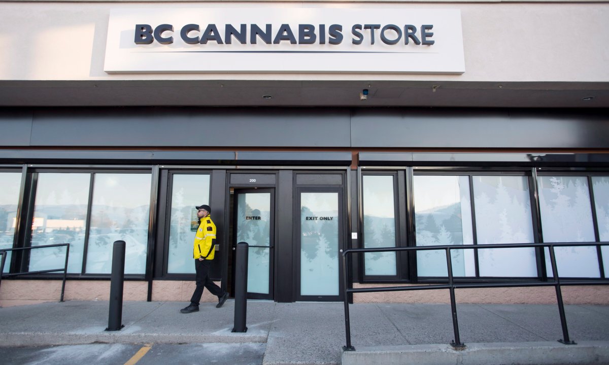 A security guard walks outside British Columbia’s first legal B.C. cannabis store in Kamloops, B.C. Tuesday, Oct. 16, 2018. Canada will legalize cannabis nation wide on Wednesday, Oct. 17 2018 allowing stores across the country to open and legally sell cannabis and cannabis products.