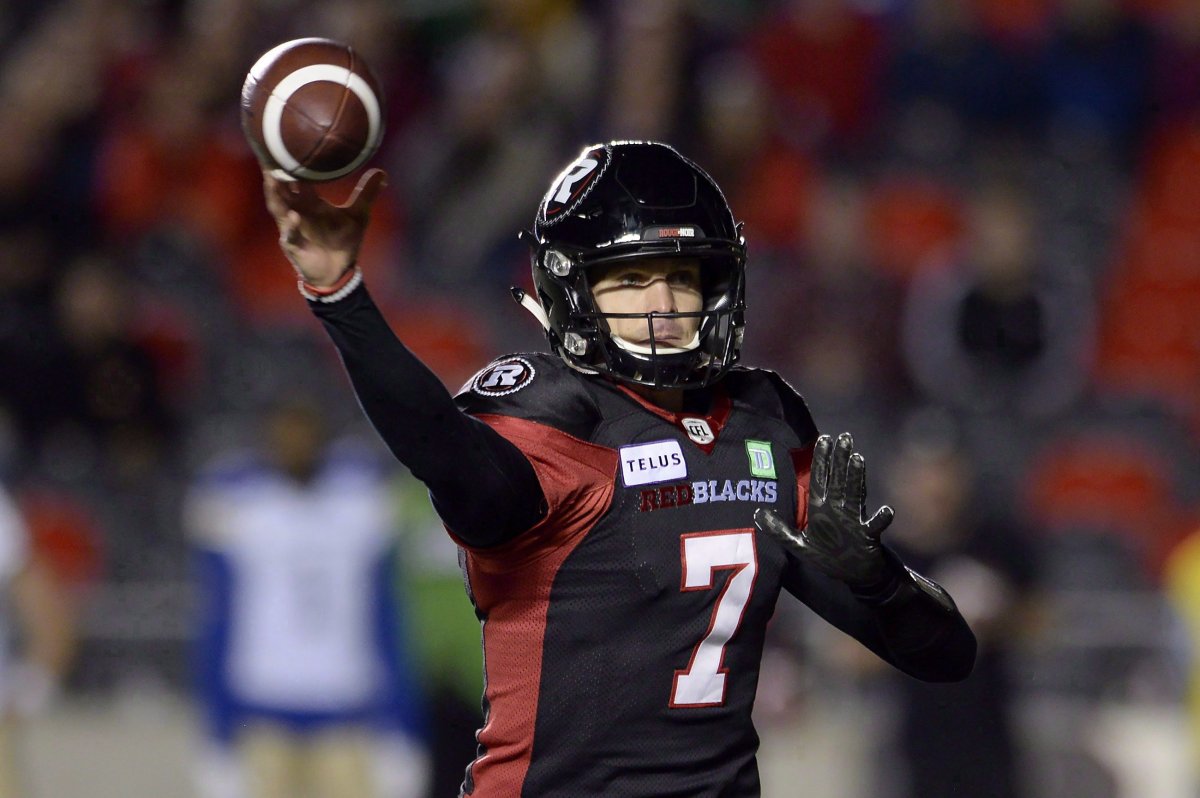 Ottawa Redblacks quarterback Trevor Harris (7) throws a pass for a touchdown during first half CFL football action against the Winnipeg Blue Bombers, in Ottawa on October 5, 2018.