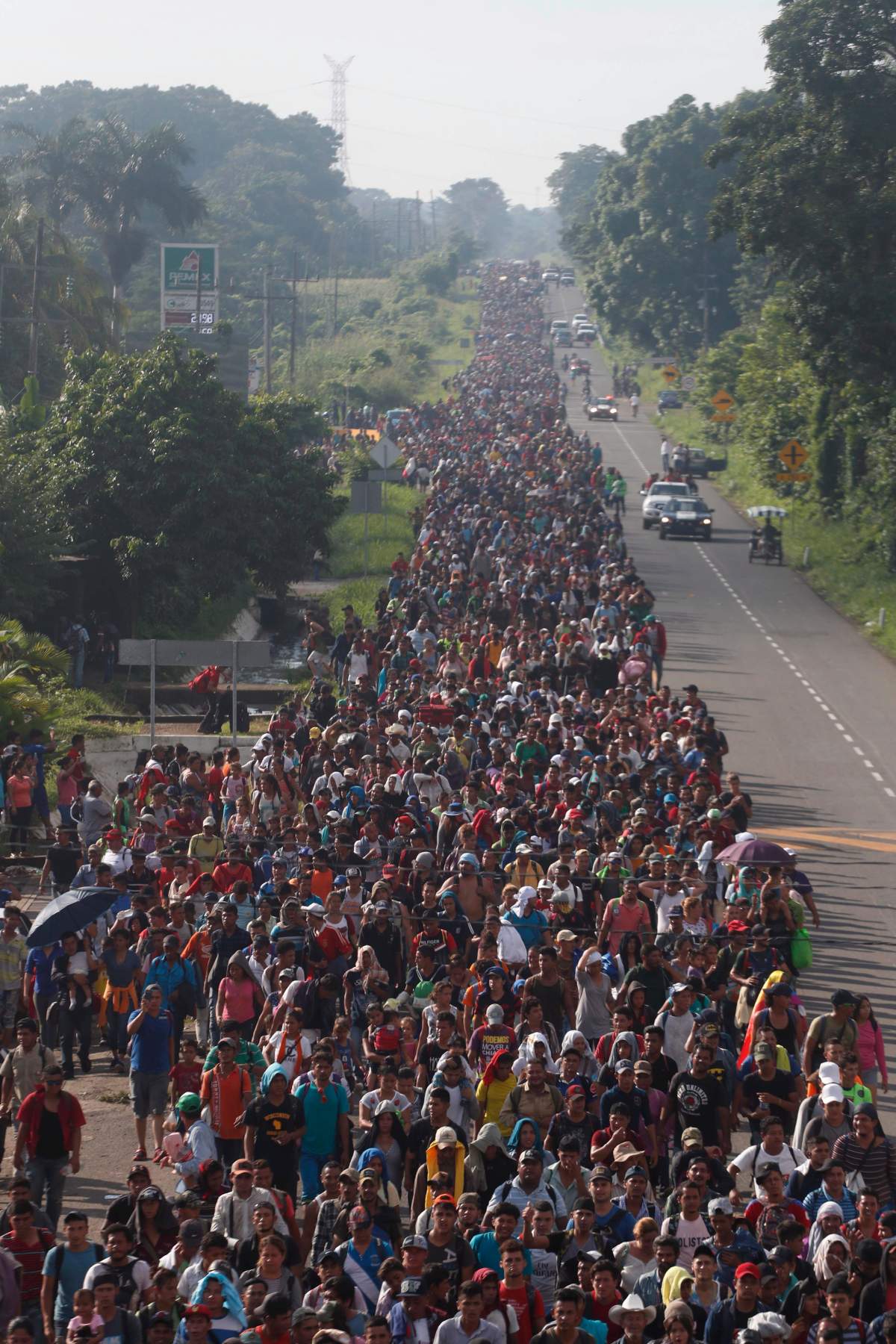 Central American migrants walking to the U.S. start their day departing Ciudad Hidalgo, Mexico, Sunday, Oct. 21, 2018.