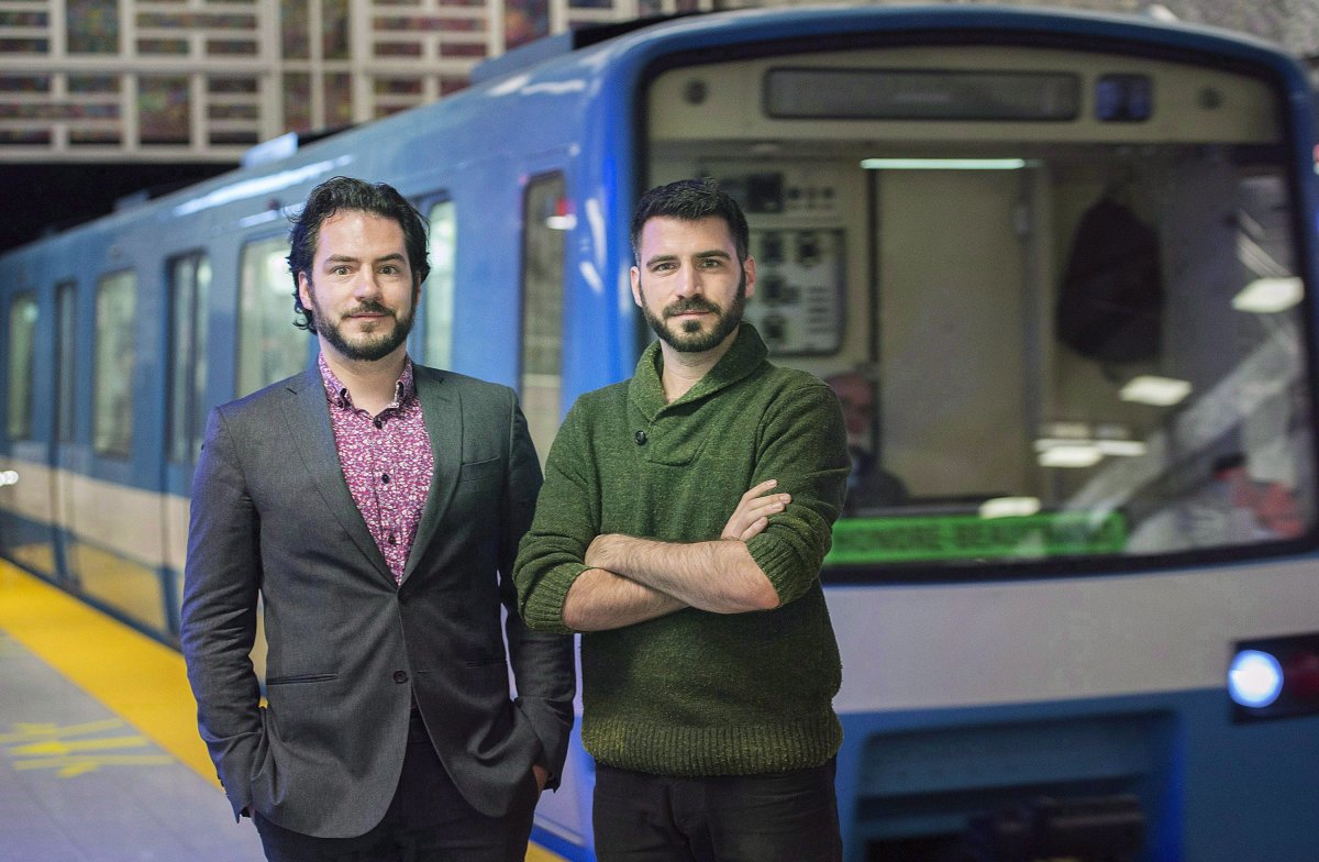 Frédéric, left, and Etienne Morin-Bordeleau, co-founders of Project MR-63 pose next to a Montreal Metro, Saturday, October 14, 2016. As Montreal's original subway cars are being gradually pulled out of service, at least a few of the 50-year-old cars will be getting second lives. 