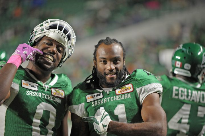 Saskatchewan Roughriders defensive lineman Tobi Antigha, left, and defensive back Ed Gainey, centre, ham it up on the sidelines en route in the dying second of a 35-16 victory over the B.C. Lions during CFL action at Mosaic Stadium in Regina on Saturday, Oct. 27, 2018.