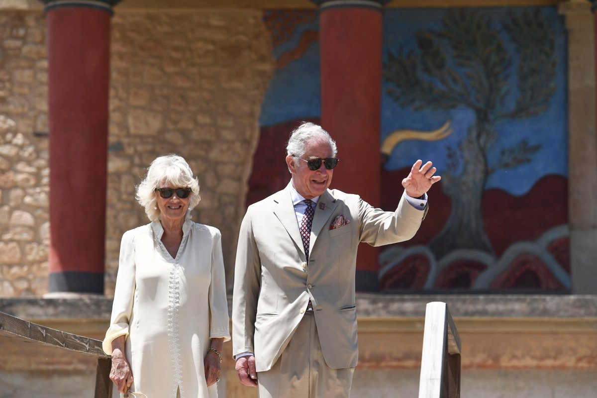 FILE - In this May 11, 2018, file photo, Britain's Prince Charles, and his wife Camilla, Duchess of Cornwall, visit the ancient site of Knossos on the southern Greek island of Crete.