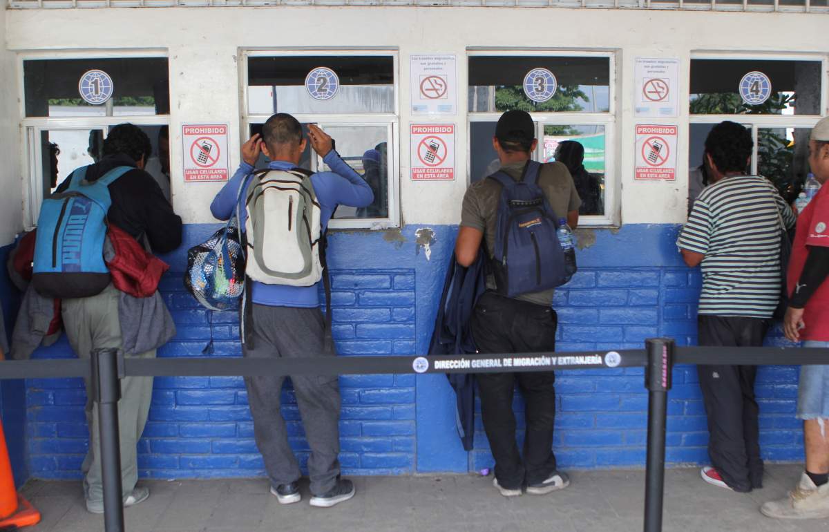 Migrants from El Salvador wait to be attended by Salvadoran migration authorities in La Hachadura, El Salvador, Wednesday, Oct. 31, 2018. A fourth group of about 700 Salvadorans set out from the capital, San Salvador, with plans to walk to the U.S. border, 1,500 miles away.