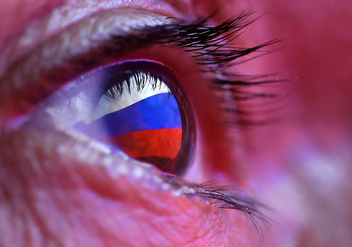 A Russian flag is reflected in an eye in this picture illustration taken October 4, 2018. 