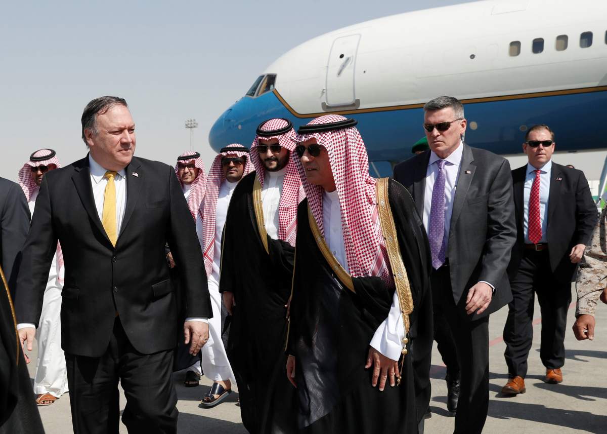 U.S. Secretary of State Mike Pompeo walks with Saudi Foreign Minister Adel al-Jubeir after arriving in Riyadh, Saudi Arabia, October 16, 2018.