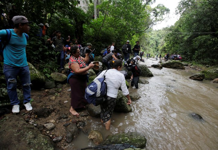 IN PHOTOS: Thousands of migrants make dangerous trek to U.S., and the ...