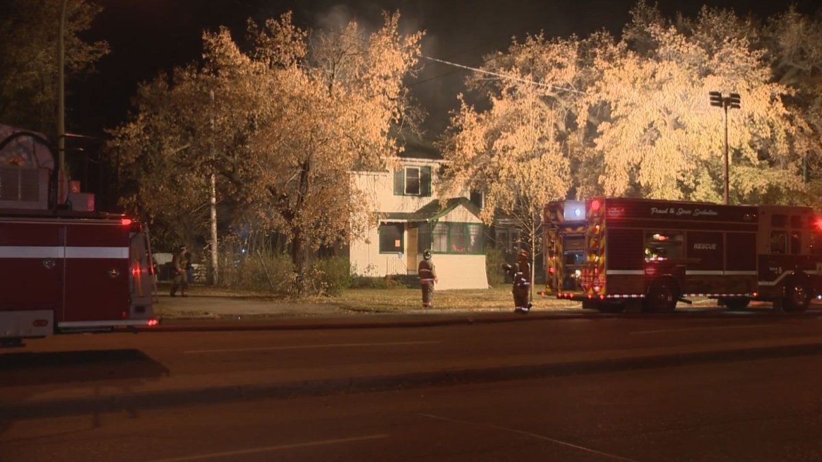 Saskatoon firefighters called to the two-storey home on 8th Street East arrived to find smoke and flame coming from the back of boarded-up house.