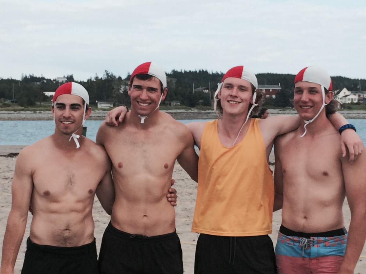 Andrew Edy with swim team members.