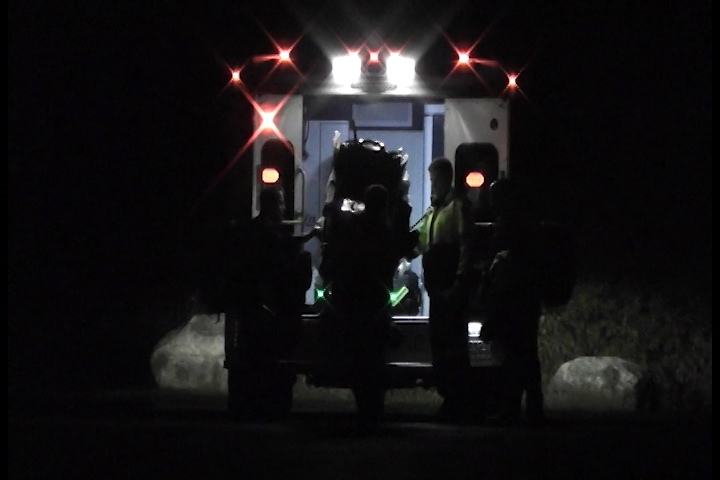 Paramedics tend to a man who crashed his ATV on County Road 44 north of Havelock on Saturday.