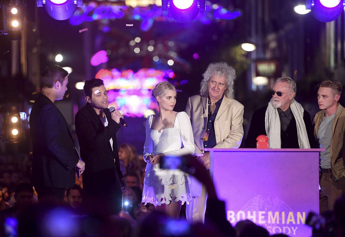 (L-R) Dave Berry, Rami Malek, Lucy Boynton, Brian May, Roger Taylor and Ben Hardy attend the Carnaby Street Bohemian Rhapsody Light Installation on Oct. 21, 2018 in London, England.