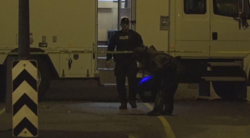 A member of the EDU transports what was later discovered to be commercial fireworks away from the tent city.