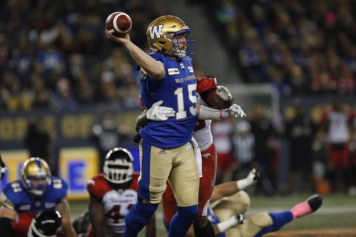 Winnipeg Blue Bombers quarterback Matt Nichols (15) gets the ball away during the first half of CFL action against the Calgary Stampeders, in Winnipeg, Friday, Oct. 26, 2018. 