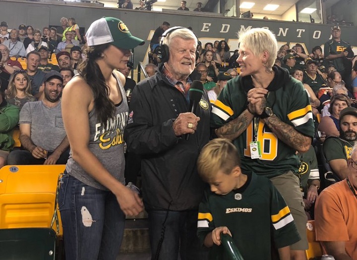 Bryan Hall is joined by boxer Jelena Mrdjenovich and rugby player Jen Kish to sing the fight song at an Edmonton Eskimos game. 