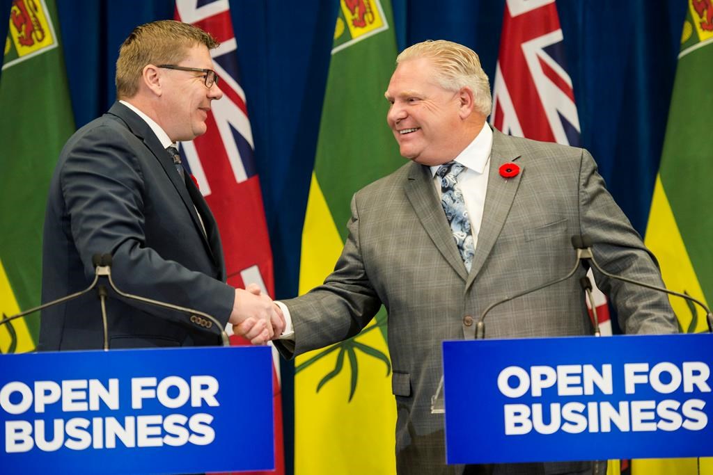 Saskatchewan Premier Scott Moe (left) and Ontario Premier Doug Ford shake hands during a joint press confererence at Queen's Park in Toronto on Monday, October 29, 2018.