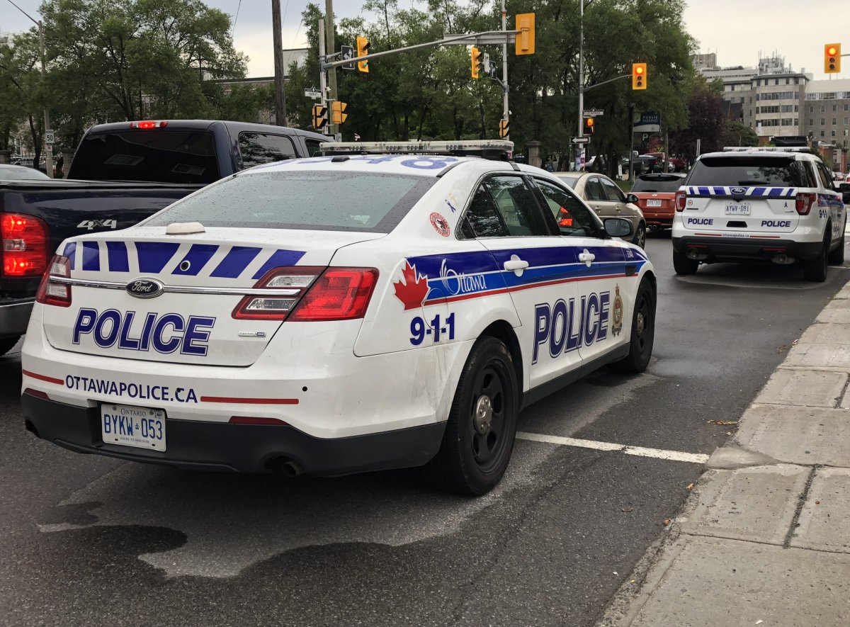 Police charged two people with firearm-related offences after seizing a gun and drugs following a collision in Ottawa.