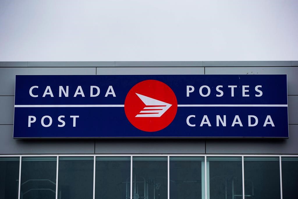 The Canada Post logo is seen on the outside the company's Pacific Processing Centre, in Richmond, B.C., on June 1, 2017. New contract proposals from Canada Post to 50,000 of its employees have failed to put an end to the threat of a work stoppage at the post office. THE CANADIAN PRESS/Darryl Dyck.