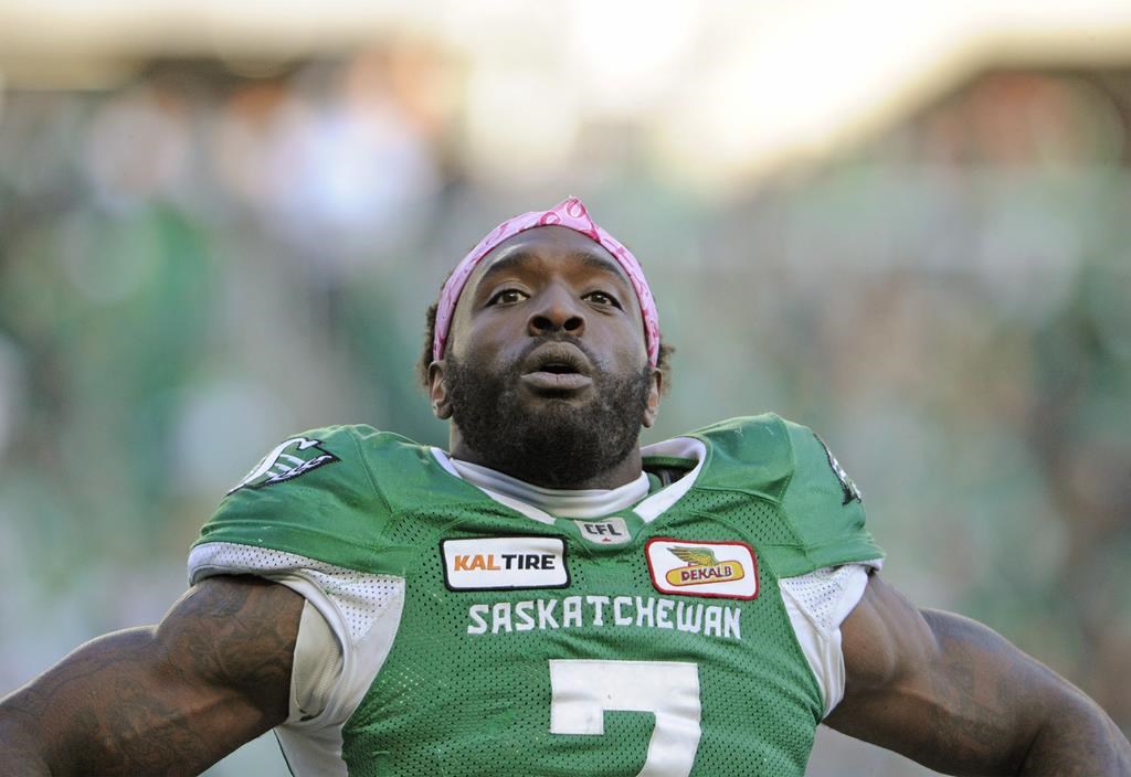 Saskatchewan Roughriders defensive lineman Willie Jefferson salutes the crowd after a fourth quarter pick six and then a sack during second half CFL action against the Edmonton Eskimos, in Regina on October 8, 2018.