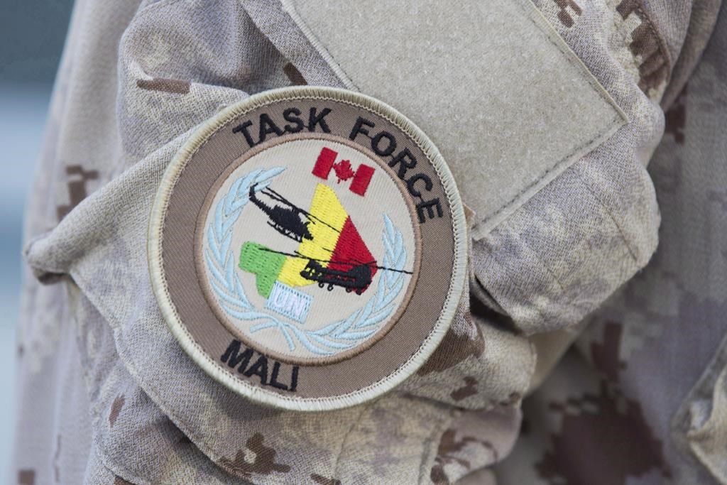 The UN Mali patch is shown on a Canadian forces member's uniform before boarding a plane at CFB Trenton in Trenton, Ont., on July 5, 2018.