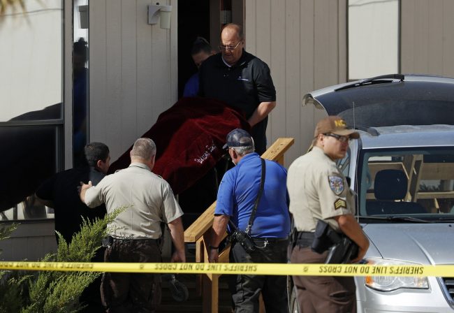 Authorities remove the body of Dennis Hof from the Love Ranch brothel in Pahrump, Nev., Oct. 16, 2018.