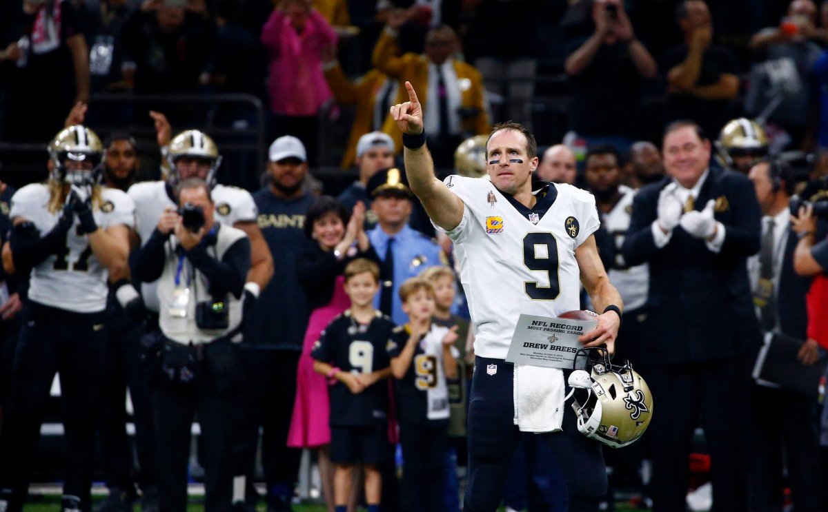 New Orleans Saints quarterback Drew Brees (9) responds to the crowd after breaking the NFL all-time passing yards record in the first half of an NFL football game against the Washington Redskins in New Orleans, Monday, Oct. 8, 2018.