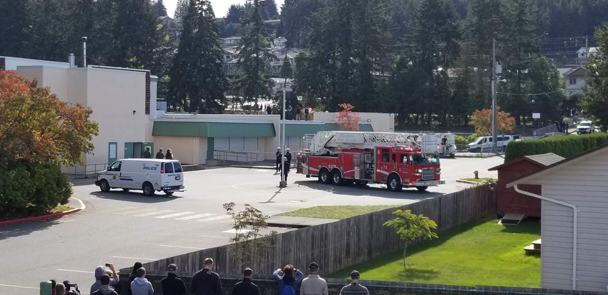 Police used a fire ladder truck to access the roof and remove squatters on Saturday.