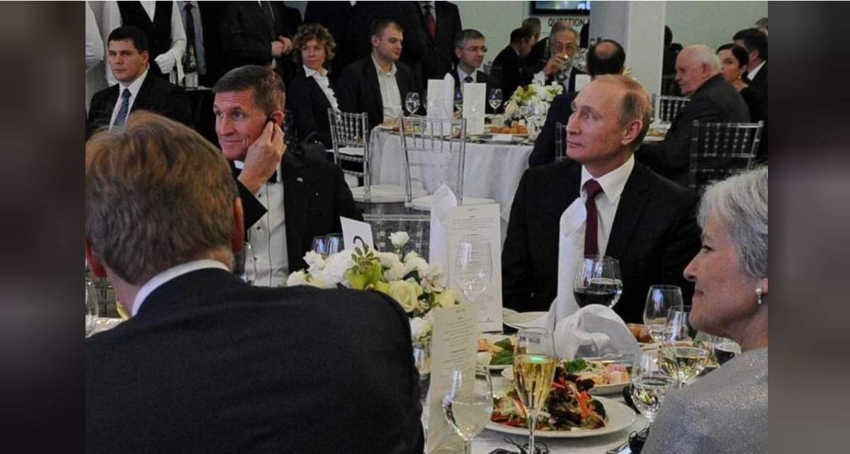 Russian President Vladimir Putin (R) sits next to retired U.S. Army Lieutenant-General Michael Flynn (L) as they attend an exhibition marking the 10th anniversary of RT (Russia Today) television news channel in Moscow, Russia, Dec. 10, 2015.