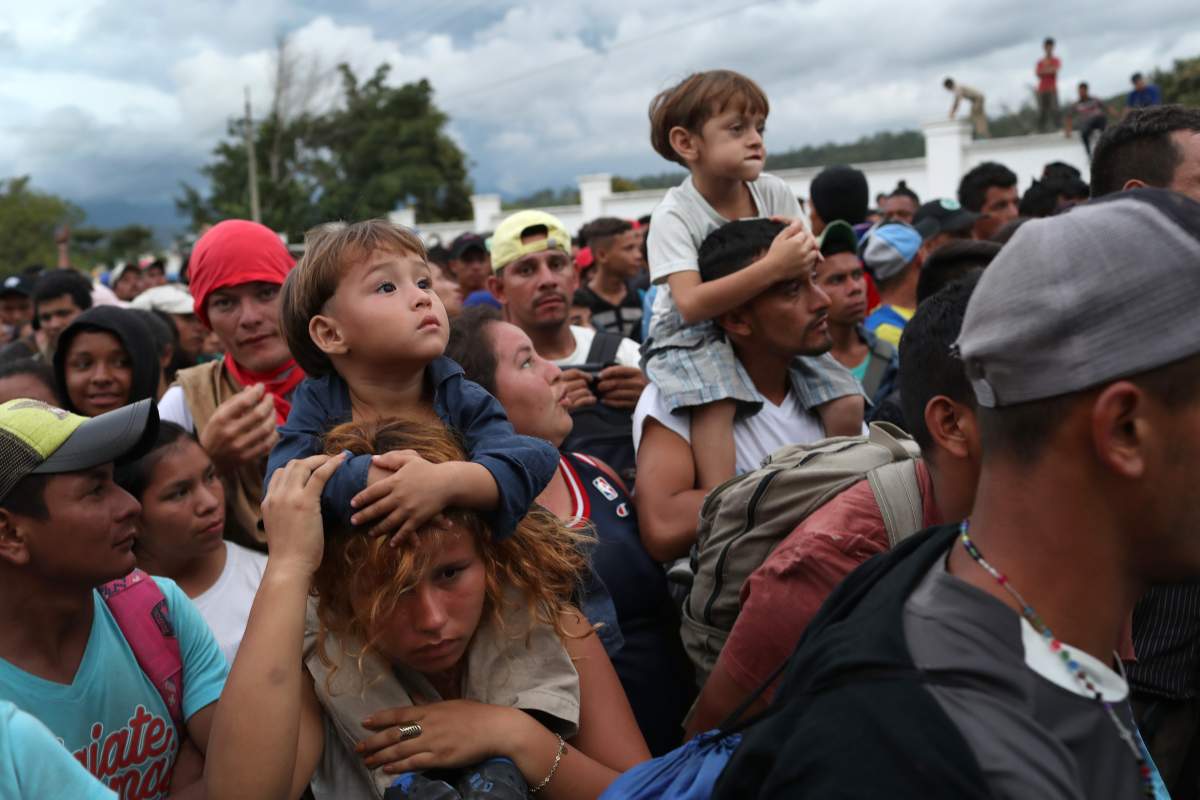 A caravan of more than 1,500 Honduran migrants moves north after crossing the border from Honduras into Guatemala on October 15, 2018, in Esquipulas, Guatemala.