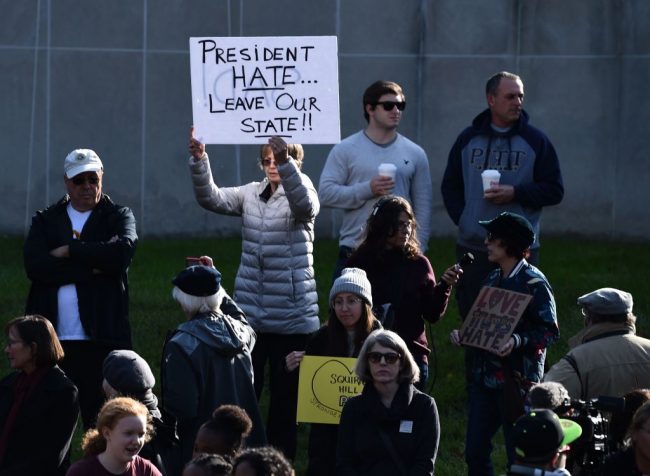 A woman protesting against U.S. President Donald Trump waits near the Tree of Life Congregation on Oct. 30, 2018 in Pittsburgh, Pa.