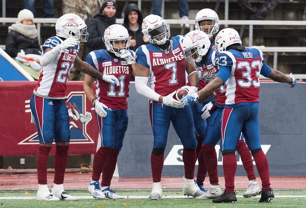 Montreal Alouettes' John Bowman (7) celebrates with teammates after scoring a touchdown during second half CFL football action against the Toronto Argonauts in Montreal, Sunday, Oct. 28, 2018.