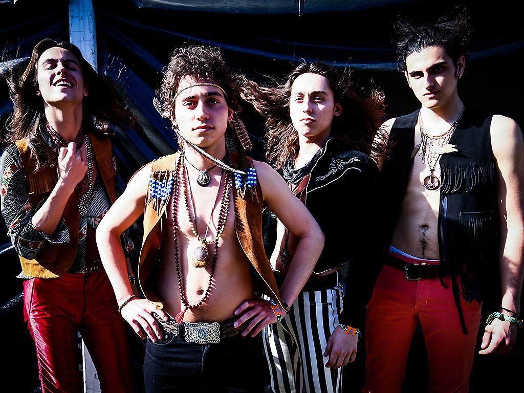 Sam Kiszka, Josh Kiszka, Jake Kiszka, and Danny Wagner of Greta Von Fleet pose backstage during the 2018 Coachella Festival.