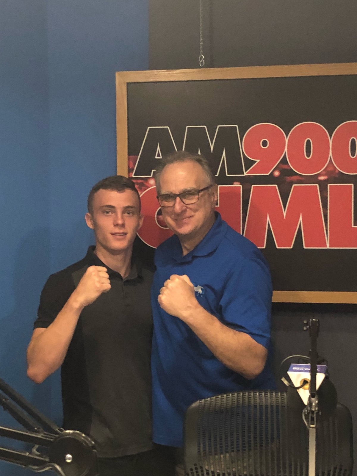 Hamilton boxer Spencer Wilcox, shown in a photo with 900 CHML's Ted Michaels, is bound for the youth Olympics in Argentina. 