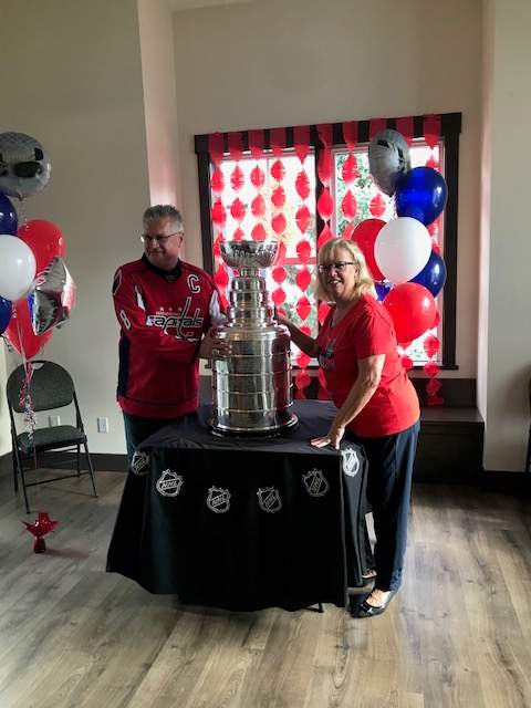 Terry and Jane Richardson show the Stanley Cup to friends and family on Wednesday.