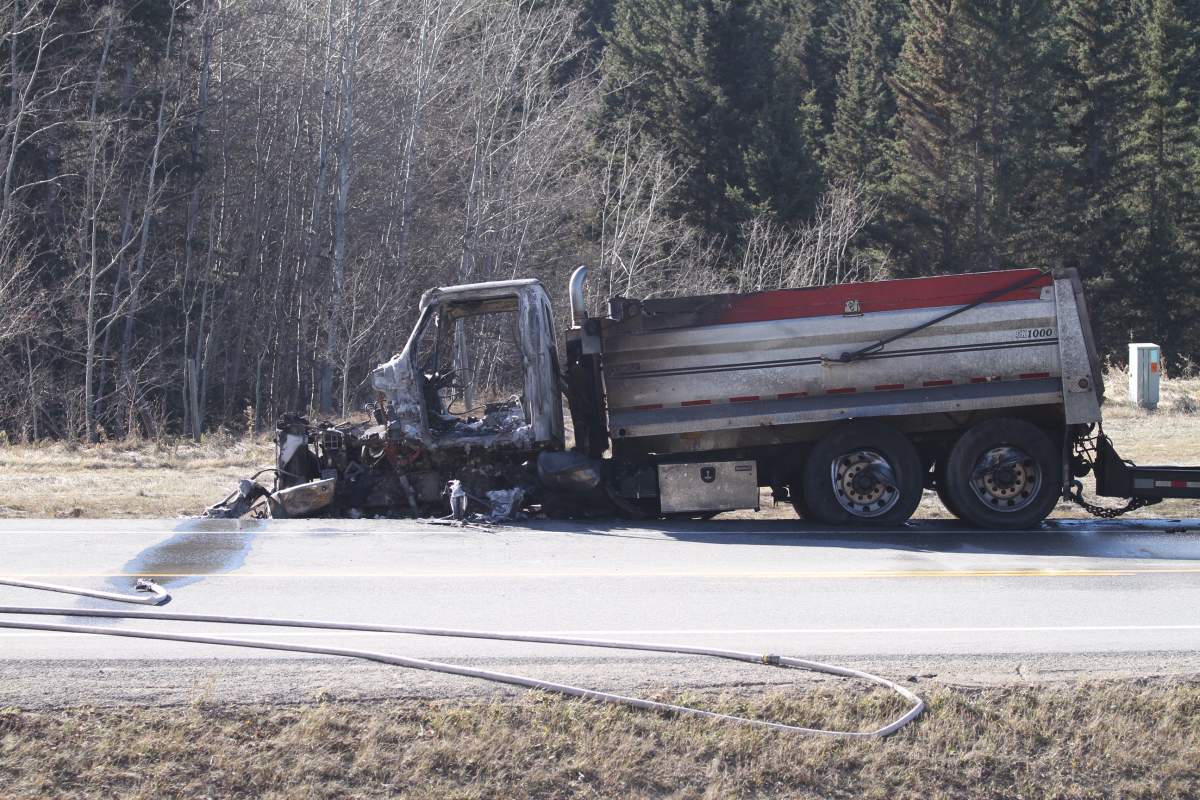 A burned out semi truck is seen at the scene of a crash on Highway 22 southwest of Calgary on Monday, Oct. 22.
