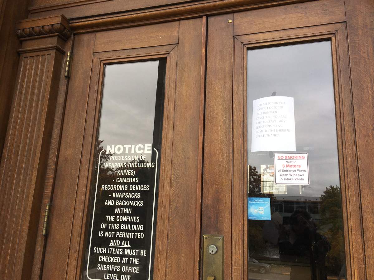 A notice on the door of the Vernon courthouse let prospective jurors know jury selection had been canceled on Monday.
