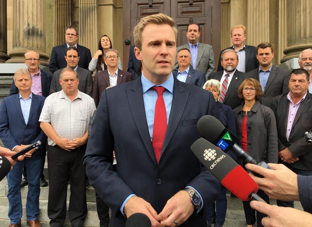 New Brunswick Premier Brian Gallant speaks to reporters in front of the provincial legislature in Fredericton on Wednesday, September 26, 2018.