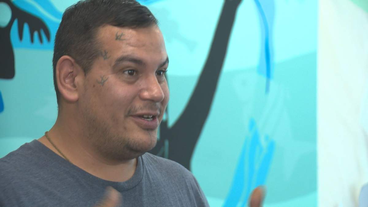 Artist Isaac Murdoch in front of the painting at MacEwan University’s kihêw waciston Indigenous Centre in Edmonton, Alta. October 30, 2018.