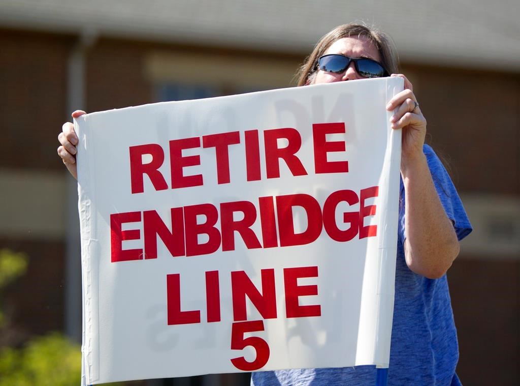 A protester at an Enbridge Line 5 pipeline public information session in Holt, Mich. on July 6, 2017.