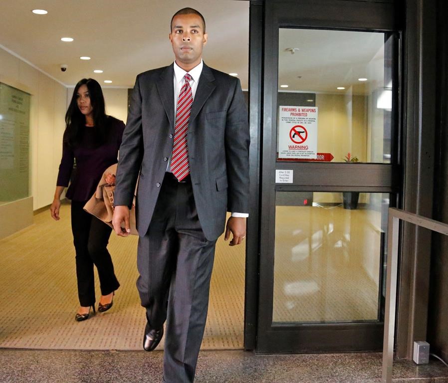 Former Minneapolis FBI agent Terry Albury walks out of the Federal Courthouse in St. Paul Thursday, Oct. 18, 2018 after Albury was sentenced to four years in prison for leaking classified defense documents to a reporter.