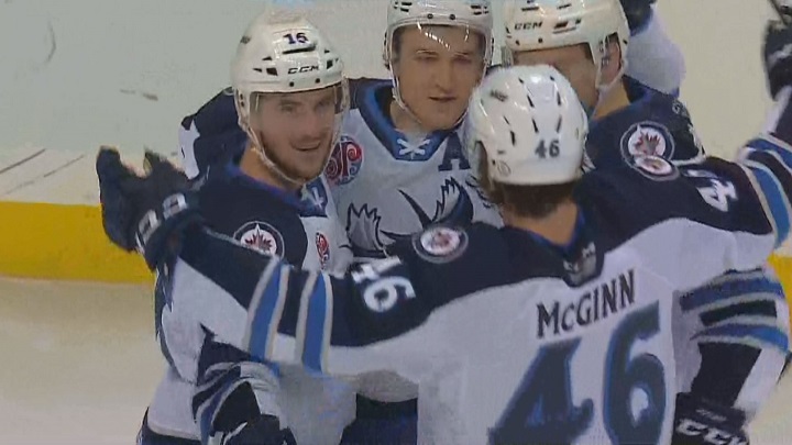 The Manitoba Moose celebrate a first period goal by JC Lipon.