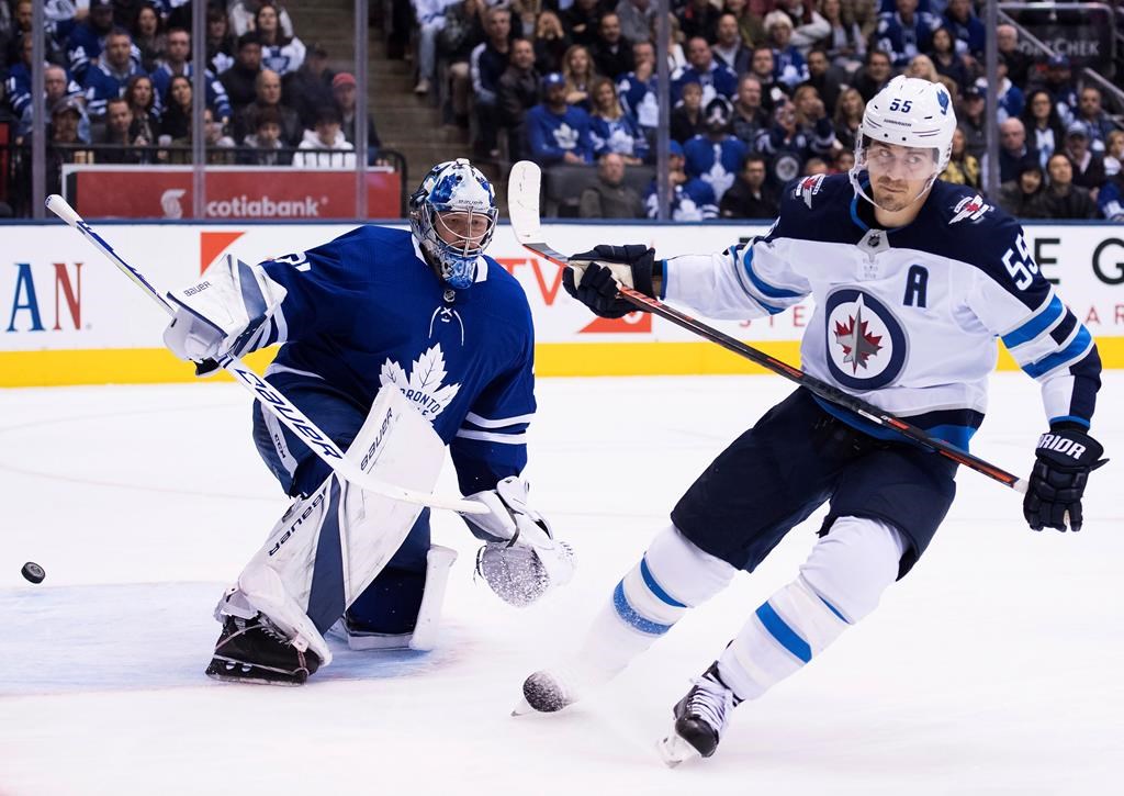 Winnipeg Jets centre Mark Scheifele (55) scores past Toronto Maple Leafs goaltender Frederik Andersen (31) during second period NHL hockey action in Toronto on Saturday, October 27, 2018.